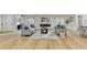 Spacious living area showcasing hardwood floors and a modern fireplace at 5255 Buice Rd, Alpharetta, GA 30022