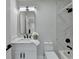 Modern bathroom with white vanity, marble tile, and black accents at 5255 Buice Rd, Alpharetta, GA 30022