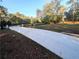 Concrete driveway with a gated entrance at 5255 Buice Rd, Alpharetta, GA 30022