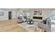 Open living room with hardwood floors, fireplace, and access to deck at 5255 Buice Rd, Alpharetta, GA 30022