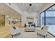 Bright living room with hardwood floors, modern furniture, and large windows at 5255 Buice Rd, Alpharetta, GA 30022