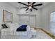 Serene bedroom with a ceiling fan and ample natural light at 5255 Buice Rd, Alpharetta, GA 30022