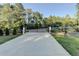 Long driveway leading to an automatic gate at 5255 Buice Rd, Alpharetta, GA 30022