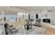 Open concept living room with hardwood floors and a staircase at 5255 Buice Rd, Alpharetta, GA 30022