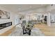 Spacious living room with hardwood floors, fireplace and kitchen access at 5255 Buice Rd, Alpharetta, GA 30022