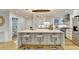 Modern kitchen with large island, stainless steel appliances, and white cabinetry at 5255 Buice Rd, Alpharetta, GA 30022