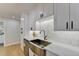 Modern kitchen with farmhouse sink and white cabinets at 5255 Buice Rd, Alpharetta, GA 30022