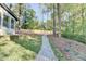 Landscaped backyard with a gravel pathway at 5255 Buice Rd, Alpharetta, GA 30022