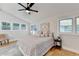 Main bedroom with hardwood floors, high ceilings and large windows at 5255 Buice Rd, Alpharetta, GA 30022