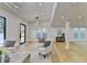 Light and airy living room with hardwood floors and large windows at 5255 Buice Rd, Alpharetta, GA 30022