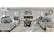 Living room featuring hardwood floors, fireplace, and ample natural light at 5255 Buice Rd, Alpharetta, GA 30022