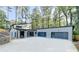 Modern home with attached garage and large windows at 5255 Buice Rd, Alpharetta, GA 30022