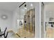 Modern glass-enclosed wine cellar with ample storage at 5255 Buice Rd, Alpharetta, GA 30022