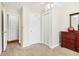 Bedroom with wood floors, ceiling fan, and adjacent hallway at 3709 Mcguire Nw St, Kennesaw, GA 30144