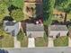 Three houses with driveways and yards, seen from above at 3709 Mcguire Nw St, Kennesaw, GA 30144