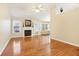 Large living room with hardwood floors, fireplace, and access to sunroom at 3709 Mcguire Nw St, Kennesaw, GA 30144