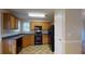 Functional kitchen featuring dark countertops and wood cabinets at 116 Country Farms Way, Rockmart, GA 30153