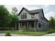 Modern farmhouse exterior with gray siding and black trim at 1247 Bridges Sw Ave # B, Atlanta, GA 30310