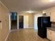 Kitchen with black appliances and light cabinets at 3715 Leisure Ln, College Park, GA 30349