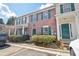 Brick townhouse with green shutters and landscaping at 3237 Panthers Trce, Decatur, GA 30034