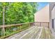 Wooden deck overlooks a wooded area, offering a peaceful outdoor space at 239 Hardy Water Dr, Lawrenceville, GA 30045