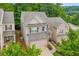 Two-story house with brick and siding exterior, two car garage, and a nicely landscaped yard at 239 Hardy Water Dr, Lawrenceville, GA 30045