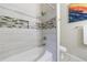 Modern bathroom with a tub/shower combo and tile accents at 1910 Cedar Glenn Way # 4403, Atlanta, GA 30339