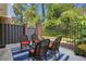 Private patio with wicker furniture and a blue and white rug at 11 Independence Nw Pl, Atlanta, GA 30318