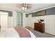 Well-lit bedroom with built-in shelving and a dresser at 11 Independence Nw Pl, Atlanta, GA 30318