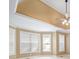 Main bedroom with tray ceiling, carpet, and large windows at 4930 Longridge Dr, Villa Rica, GA 30180