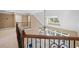 Open upper floor overlooking living area with large windows and wood railing at 4930 Longridge Dr, Villa Rica, GA 30180