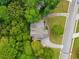 Aerial view showing house, driveway, and surrounding trees at 4930 Longridge Dr, Villa Rica, GA 30180