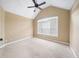 Bright bedroom with ceiling fan and large window at 4930 Longridge Dr, Villa Rica, GA 30180
