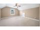 Spacious bedroom with ceiling fan and window at 4930 Longridge Dr, Villa Rica, GA 30180
