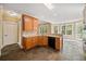 Kitchen with granite countertops, wood cabinets, and slate floors at 4930 Longridge Dr, Villa Rica, GA 30180