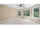 Bright bedroom with large windows and ceiling fan at 4930 Longridge Dr, Villa Rica, GA 30180