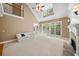 Two-story living room with hardwood floors, fireplace, and lots of natural light at 4930 Longridge Dr, Villa Rica, GA 30180