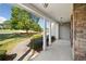 Covered porch with white columns, stone wall, and view of yard at 4930 Longridge Dr, Villa Rica, GA 30180