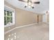 Finished basement offering tile floors, large windows, and a ceiling fan at 4930 Longridge Dr, Villa Rica, GA 30180