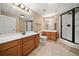 Basement bathroom with double sinks, shower, and toilet at 4930 Longridge Dr, Villa Rica, GA 30180