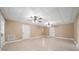 Finished basement featuring tile floors, ceiling fans, and multiple rooms at 4930 Longridge Dr, Villa Rica, GA 30180