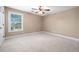 Charming bedroom with ceiling fan and window at 4930 Longridge Dr, Villa Rica, GA 30180