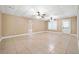 Spacious finished basement with tile flooring and ceiling fans at 4930 Longridge Dr, Villa Rica, GA 30180