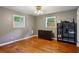 Bedroom with hardwood floors, neutral walls, and a dresser at 3024 Bob Cox Rd, Marietta, GA 30064