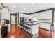 Modern kitchen with a large island, white cabinets, and granite countertops at 713 Bronze Ct, Acworth, GA 30102