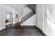 Elegant entryway with dark hardwood floors and modern staircase at 3376 Peachtree Rd # 1, Atlanta, GA 30326