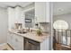 Kitchen with white cabinets, stainless steel dishwasher, and granite countertops at 1078 Piedmont Ne Ave # 106, Atlanta, GA 30309