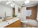Modern bathroom with light wood vanity, neutral tile, and bathtub at 1078 Piedmont Ne Ave # 106, Atlanta, GA 30309