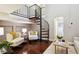 Living room with spiral staircase, comfy armchairs, and a coffee table at 1078 Piedmont Ne Ave # 106, Atlanta, GA 30309