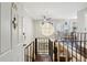 Two-story entryway with hardwood floors, a loft, and open staircase at 1078 Piedmont Ne Ave # 106, Atlanta, GA 30309